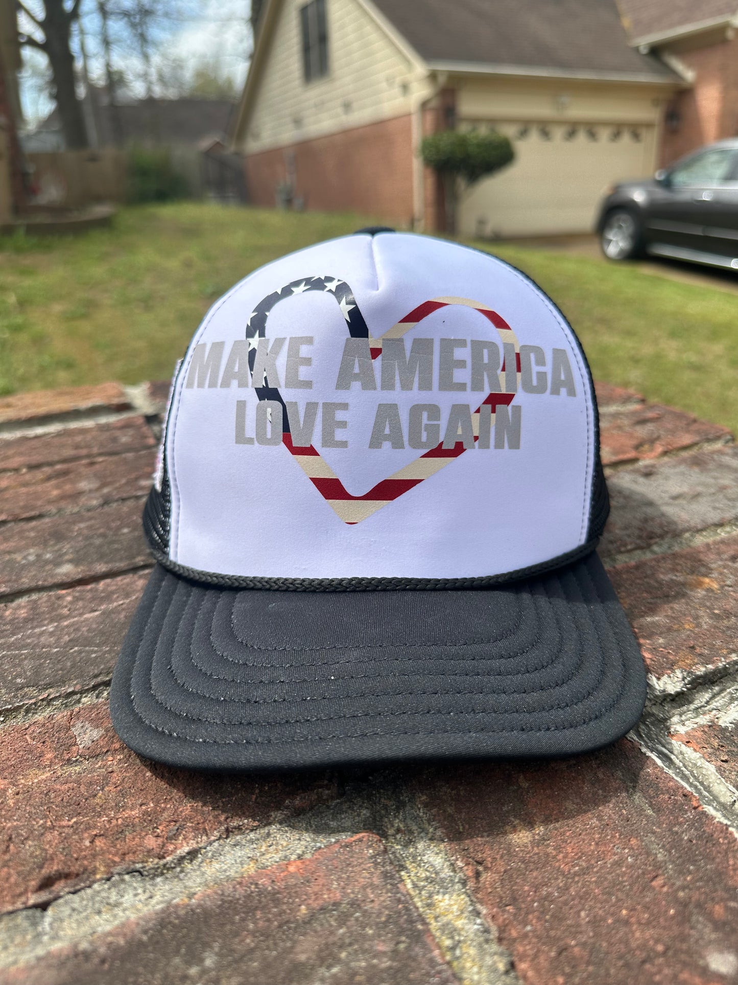 WE LOVE ALL TRUCKER HAT